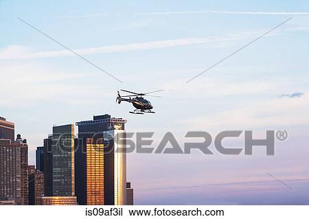 Helicopter and office buildings, New York, USA View Large Photo Image Stock Image - Helicopter and office buildings, New York, USA. Fotosearch