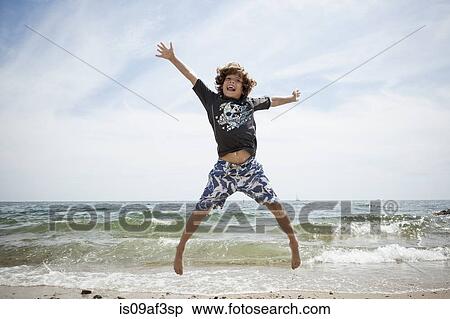 Informal portrait of jumping boy on beach at Falmouth, Massachusetts, USA View Large Photo Image Stock Photography - Informal portrait of jumping boy on beach at Falmouth, Massachusetts, USA. Fotosearch