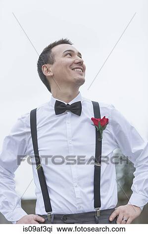 Informal portrait of smiling groom at wedding View Large Photo Image Stock Image - Informal portrait of smiling groom at wedding. Fotosearch
