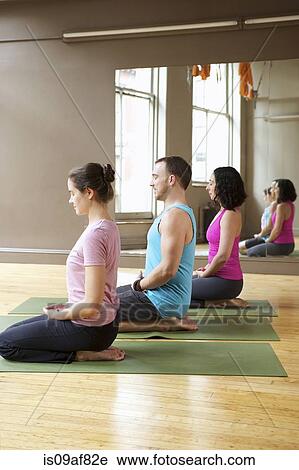 People kneeling in yoga class View Large Photo Image Stock Image - People kneeling in yoga class. Fotosearch