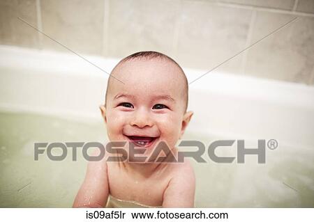 Portrait of baby boy enjoying a bath View Large Photo Image Stock Photography - Portrait of baby boy enjoying a bath. Fotosearch