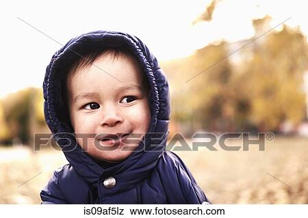 Portrait of baby boy in hooded anorak View Large Photo Image Stock Photo - Portrait of baby boy in hooded anorak. Fotosearch