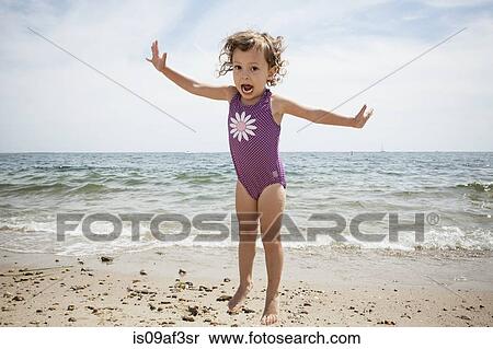 Portrait of jumping female toddler on beach at Falmouth, Massachusetts, USA View Large Photo Image Stock Photography - Portrait of jumping female toddler on beach at Falmouth, Massachusetts, USA. Fotosearch