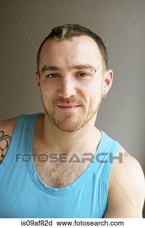 Portrait of man wearing turquoise vest View Large Photo Image Stock Image - Portrait of man wearing turquoise vest. Fotosearch