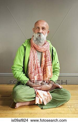 Portrait of mature man sitting in lotus pose on floor View Large Photo Image Picture - Portrait of mature man sitting in lotus pose on floor. Fotosearch