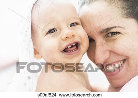 Picture - Portrait of mother and daughter smiling. Fotosearch