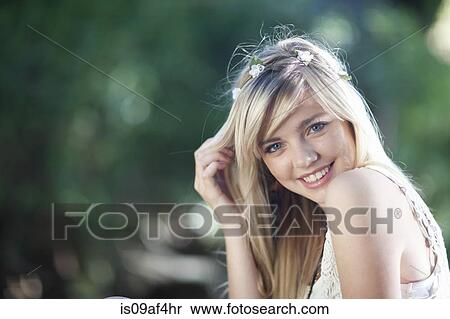 Stock Photography - Portrait of teenage girl in woodland. Fotosearch