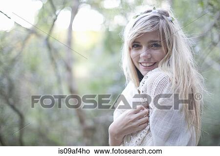 Portrait of teenage girl wrapped in shawl in woodland View Large Photo Image Picture - Portrait of teenage girl wrapped in shawl in woodland. Fotosearch