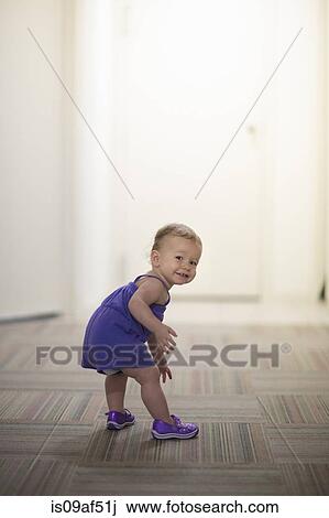 Portrait of toddler girl wearing purple clothes View Large Photo Image Stock Image - Portrait of toddler girl wearing purple clothes. Fotosearch
