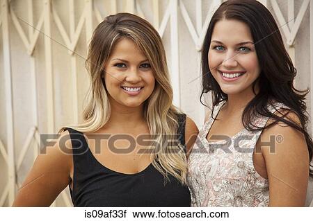 Stock Image - Portrait of young women smiling. Fotosearch