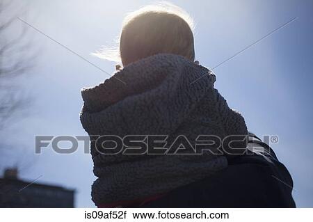 Rear view of mother shoulder carrying daughter View Large Photo Image Stock Image - Rear view of mother shoulder carrying daughter. Fotosearch