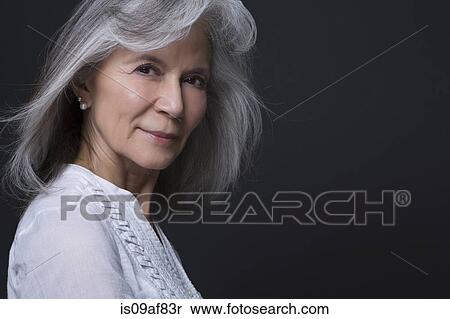 Studio portrait of beautiful senior woman View Large Photo Image Stock Photography - Studio portrait of beautiful senior woman. Fotosearch