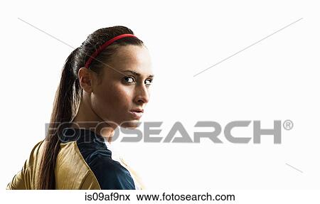 Stock Photo - Studio portrait of young female soccer player. Fotosearch