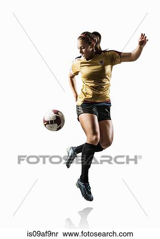 Studio shot of young female soccer player back kicking ball View Large Photo Image Stock Photography - Studio shot of young female soccer player back kicking ball. Fotosearch