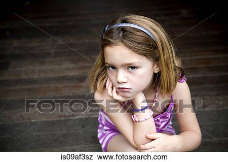 Sullen young girl sitting on porch with hands on chin View Large Photo Image Stock Photo - Sullen young girl sitting on porch with hands on chin. Fotosearch