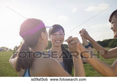 Three young female runners getting ready to run View Large Photo Image Stock Image - Three young female runners getting ready to run. Fotosearch