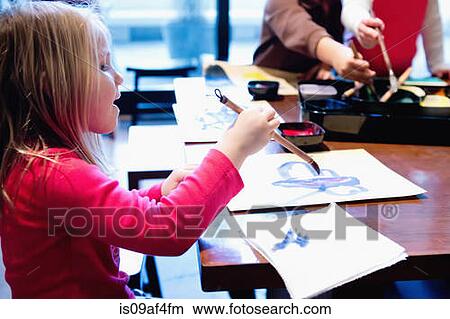 Three young siblings painting pictures at table View Large Photo Image Picture - Three young siblings painting pictures at table. Fotosearch