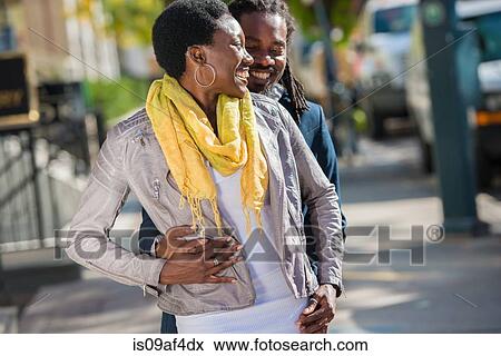 Stock Photo - Tourist couple on street outside hotel, Toronto, Ontario, Canada. Fotosearch