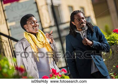 Stock Photo - Tourist couple strolling, Toronto, Ontario, Canada. Fotosearch