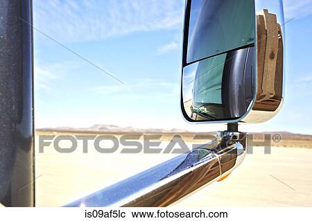 View of car wing mirror, arid landscape and distant mountains View Large Photo Image Stock Image - View of car wing mirror, arid landscape and distant mountains. Fotosearch