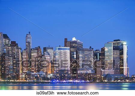 View of New York skyline at dusk View Large Photo Image Stock Image - View of New York skyline at dusk. Fotosearch