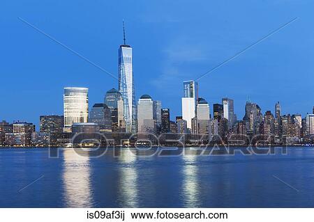 View of river and New York skyline at dusk View Large Photo Image Stock Image - View of river and New York skyline at dusk. Fotosearch
