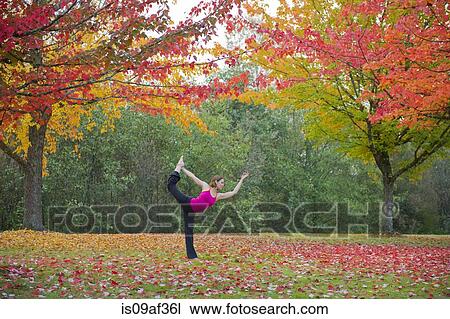 Woman practising yoga in forest View Large Photo Image Stock Image - Woman practising yoga in forest. Fotosearch
