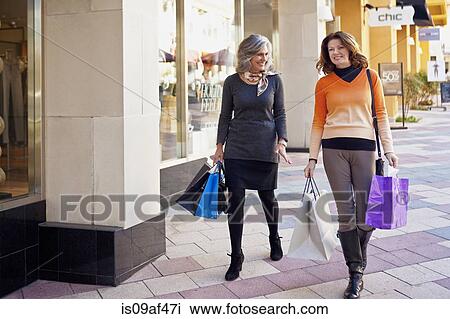 Women on shopping spree View Large Photo Image Stock Image - Women on shopping spree. Fotosearch