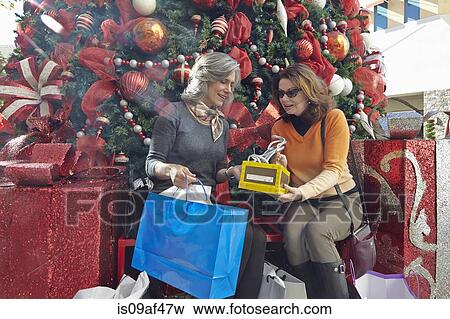 Stock Photo - Women with Christmas shopping. Fotosearch