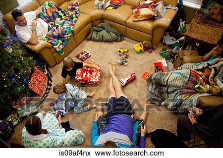 Stock Photo - Young brothers opening gifts on xmas day. Fotosearch