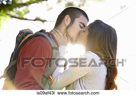 Stock Image - Young couple kissing. Fotosearch