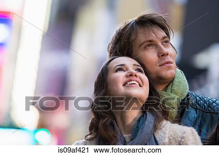 Young couple on vacation looking up, New York City, USA View Large Photo Image Stock Image - Young couple on vacation looking up, New York City, USA. Fotosearch