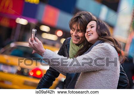 Stock Image - Young couple taking a selfie, New York City, USA. Fotosearch