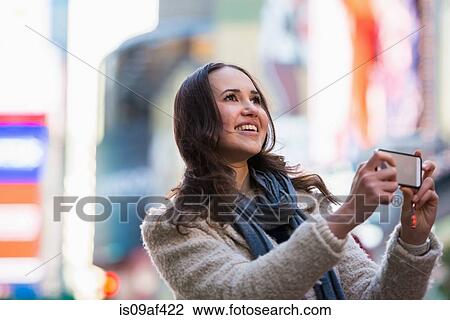 Young female tourist photographing, New York City, USA View Large Photo Image Stock Image - Young female tourist photographing, New York City, USA. Fotosearch