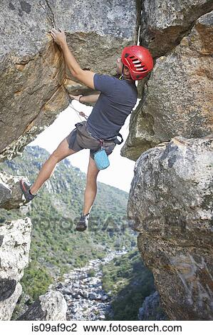 Young male rock climber balancing and holding rope View Large Photo Image Stock Image - Young male rock climber balancing and holding rope. Fotosearch