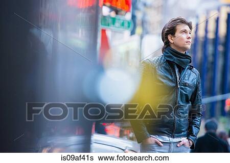 Stock Photograph - Young male tourist exploring streets, New York City, USA. Fotosearch
