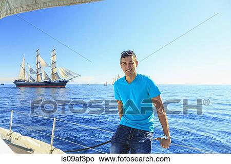 Picture - Young man sailing, San Diego, California, USA. Fotosearch