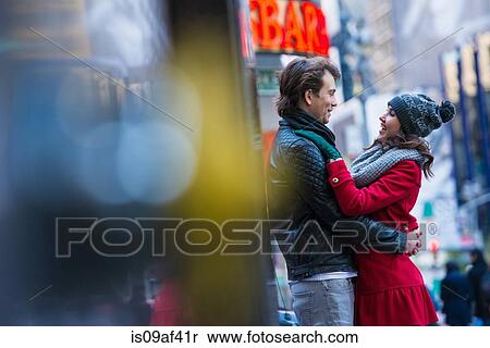 Stock Photography - Young tourist couple hugging, New York City, USA. Fotosearch