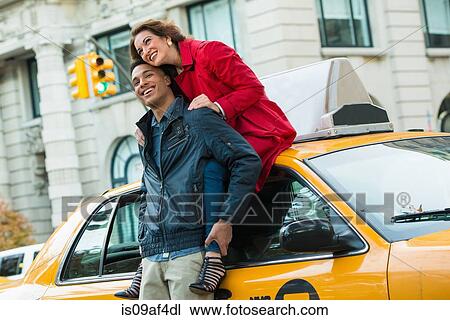 Young tourist couple with yellow cab, New York City, USA View Large Photo Image Stock Image - Young tourist couple with yellow cab, New York City, USA. Fotosearch