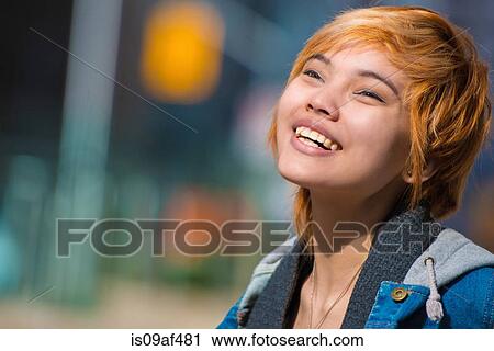 Young woman in the city View Large Photo Image Stock Image - Young woman in the city. Fotosearch