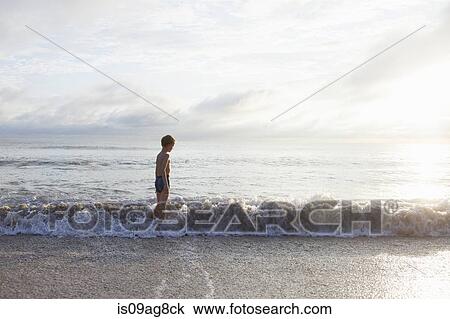 Boy going for swim in sea View Large Photo Image Stock Image - Boy going for swim in sea. Fotosearch