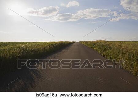 Country road through fields (Route du Mitan), Saint-Jean, Ile d'Orleans, Quebec View Large Photo Image Stock Photograph - Country road through fields (Route du Mitan), Saint-Jean, Ile d'Orleans, Quebec. Fotosearch