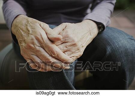 Cropped shot of senior woman with hands on knee View Large Photo Image Stock Photograph - Cropped shot of senior woman with hands on knee. Fotosearch