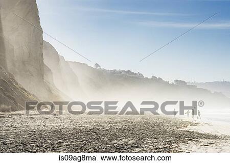 Distant view of surfers on misty beach, Black Beach, La Jolla, California, USA View Large Photo Image Stock Image - Distant view of surfers on misty beach, Black Beach, La Jolla, California, USA. Fotosearch