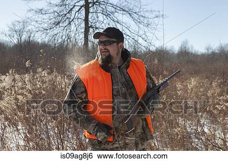 Mid adult male hunter in Petersburg State Game Area, Michigan, USA View Large Photo Image Stock Photograph - Mid adult male hunter in Petersburg State Game Area, Michigan, USA. Fotosearch