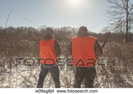 Mid adult man and teenage son hunting in Petersburg State Game Area, Michigan, USA View Large Photo Image Picture - Mid adult man and teenage son hunting in Petersburg State Game Area, Michigan, USA. Fotosearch