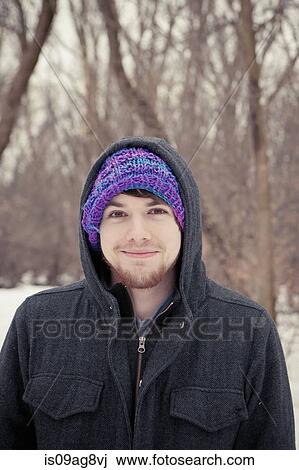 Portrait of young man in purple knit hat View Large Photo Image Stock Image - Portrait of young man in purple knit hat. Fotosearch