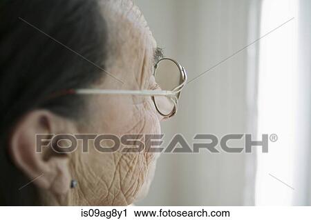 Stock Image - Senior woman wearing glasses. Fotosearch