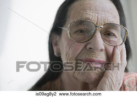 Senior woman wearing glasses View Large Photo Image Stock Image - Senior woman wearing glasses. Fotosearch