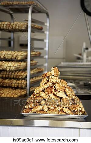 Stack of waffles on baking tray in bakery View Large Photo Image Stock Image - Stack of waffles on baking tray in bakery. Fotosearch